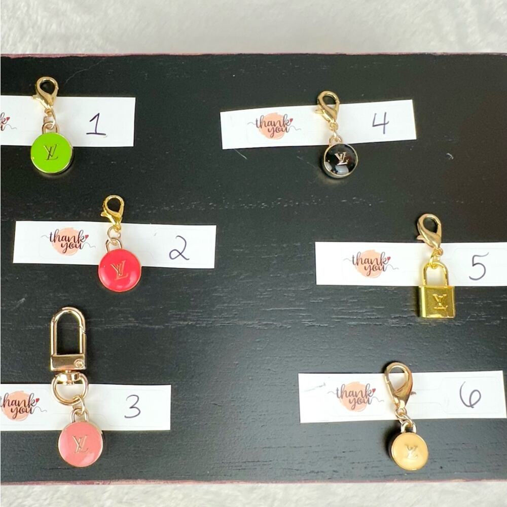 Louis Vuitton zipper pull charms ONE